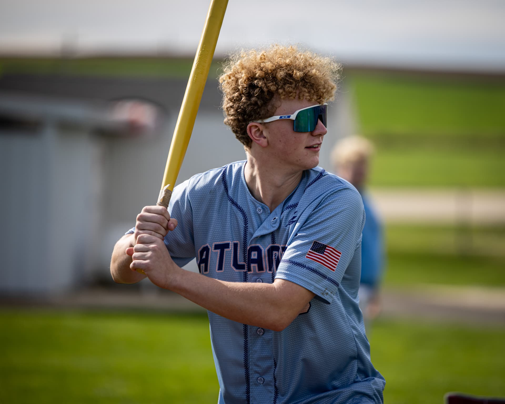 Batter ready with the yellow Wiffle bat